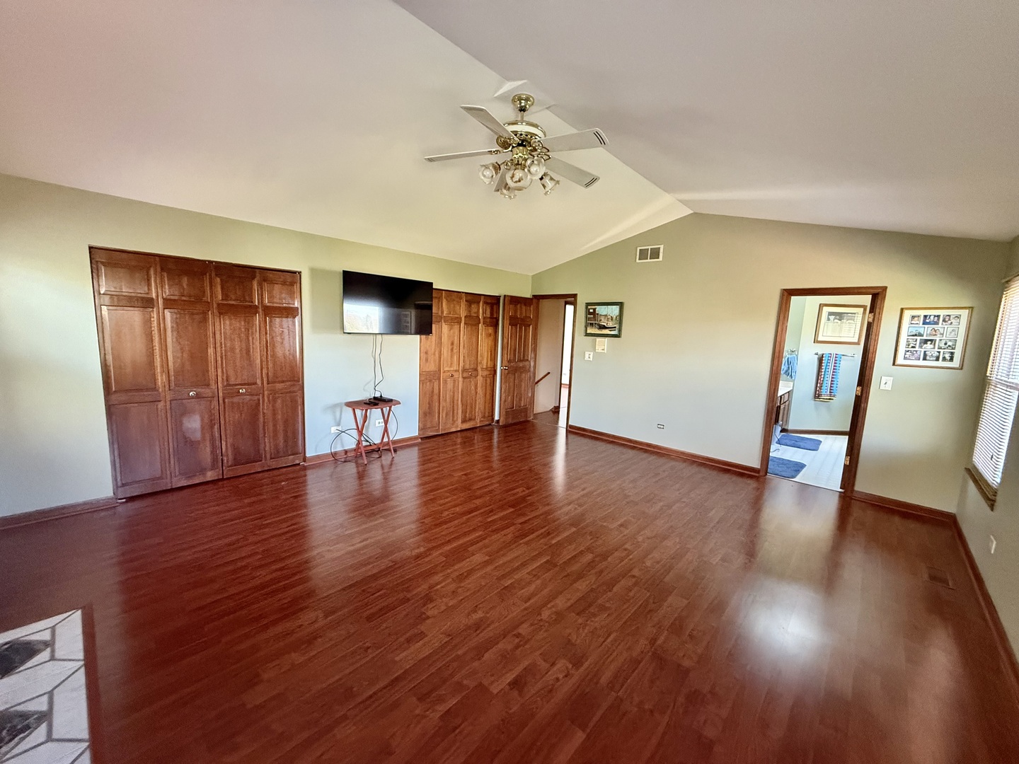 721 Mohican Trail Lake In The Hills, IL 60156 - Photo 9 of 20 a view of empty room with wooden floor and ceiling fan