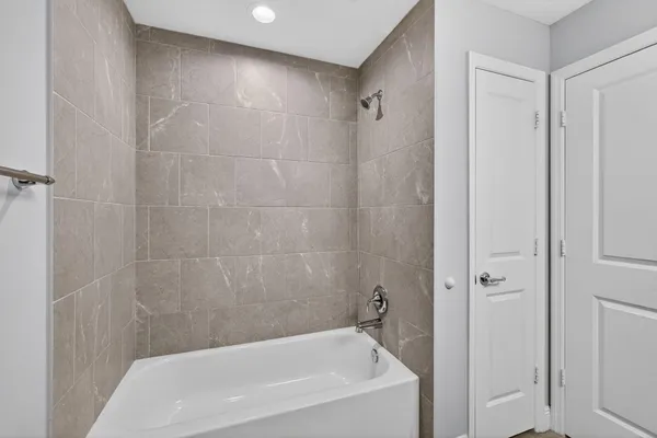 a bathroom with a granite countertop sink a toilet and a mirror