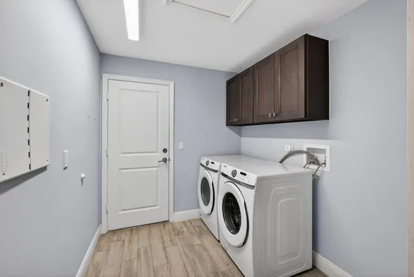 a kitchen with stainless steel appliances granite countertop wooden cabinets a stove top oven a sink and dishwasher