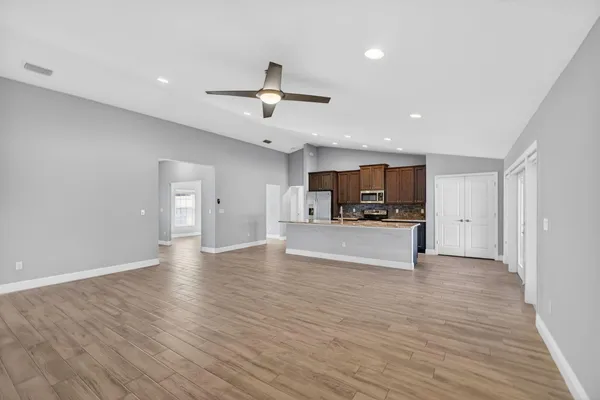 a view of a room with wooden floor and garden