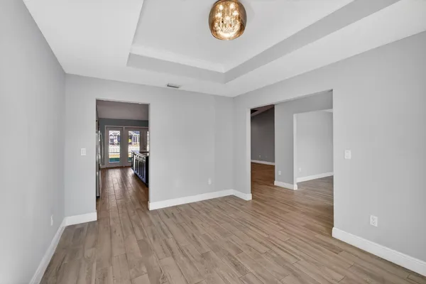 a view of livingroom with hardwood floor and a ceiling fan