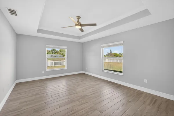 a view of an empty room with a kitchen