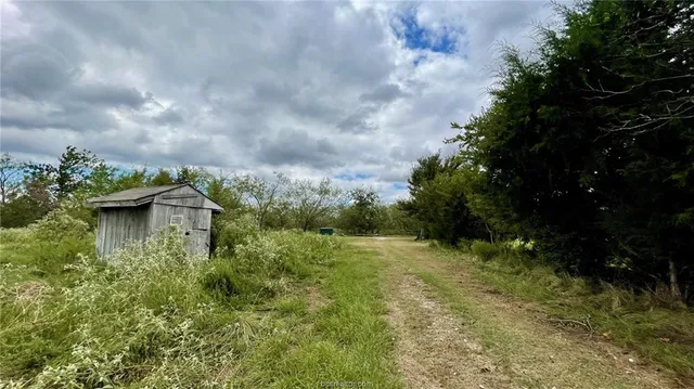 a view of a lake with lots of green space