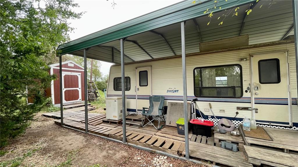 3871 Webb Cemetery Road Calvert, TX 77837 - Photo 16 of 19 a view of a chairs and table in the back yard