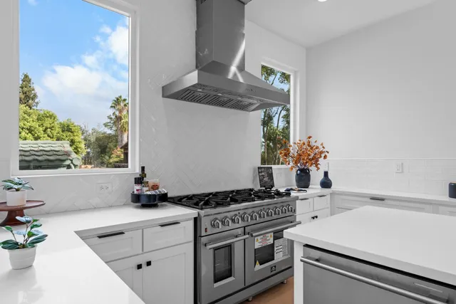 a view of a hallway with wooden floor and entryway
