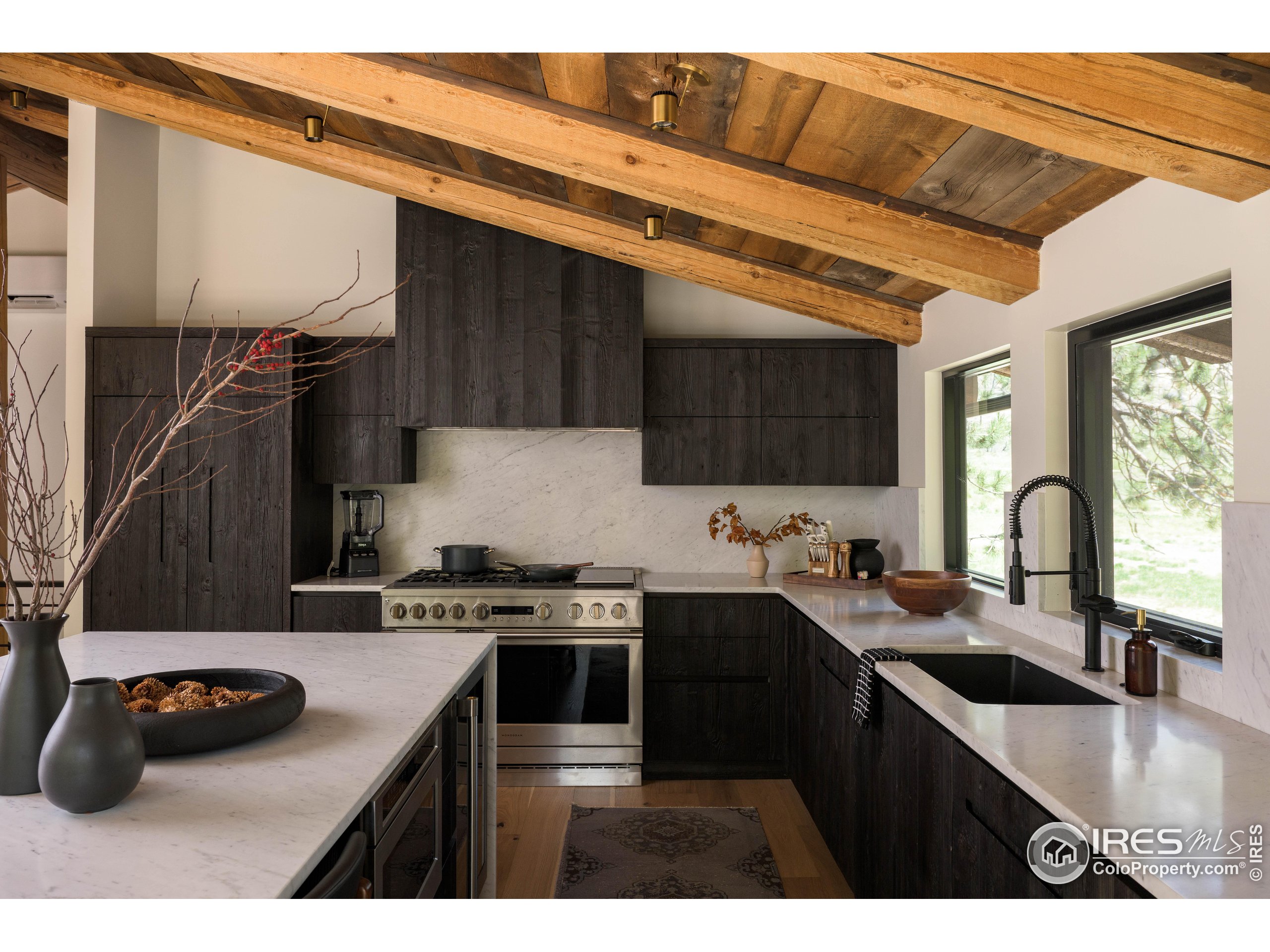 37797 W Highway Bellvue, CO 80512 - Photo 14 of 40 a kitchen with a sink a stove and cabinets