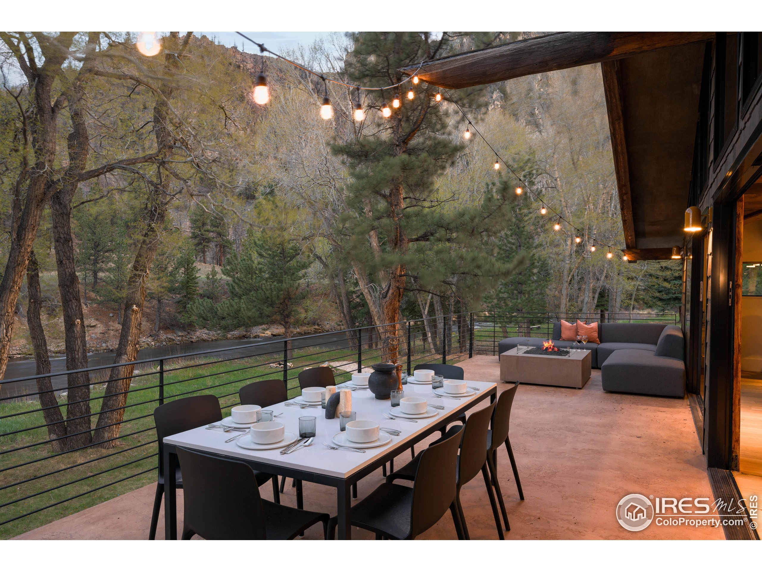 37797 W Highway Bellvue, CO 80512 - Photo 19 of 40 a view of a terrace with furniture and a yard