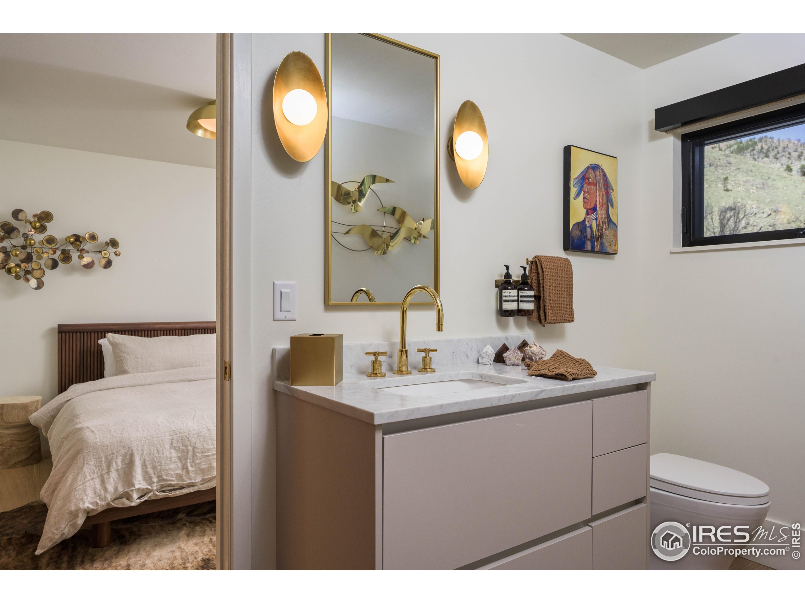 37797 W Highway Bellvue, CO 80512 - Photo 29 of 40 a bathroom with a sink and a mirror