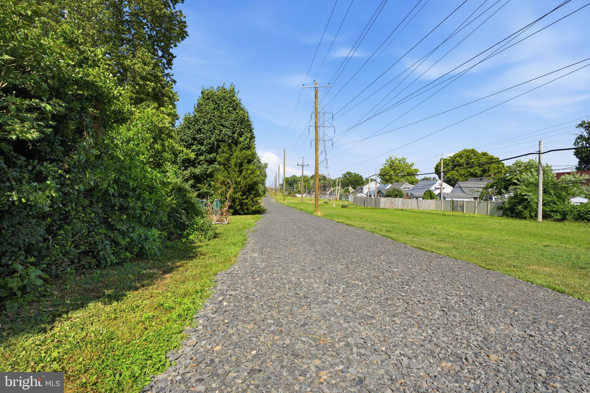 24 Idolstone Road Levittown, PA 19057 - Photo 39 of 44 Path provides ease of lawn care!