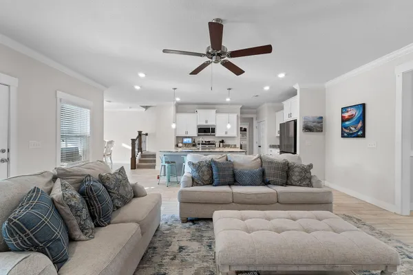 a kitchen with granite countertop a sink a counter space stainless steel appliances and cabinets