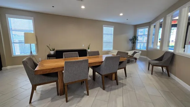 a dining room with furniture and window
