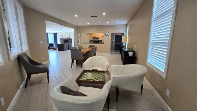 a kitchen with a dining table chairs and a stove