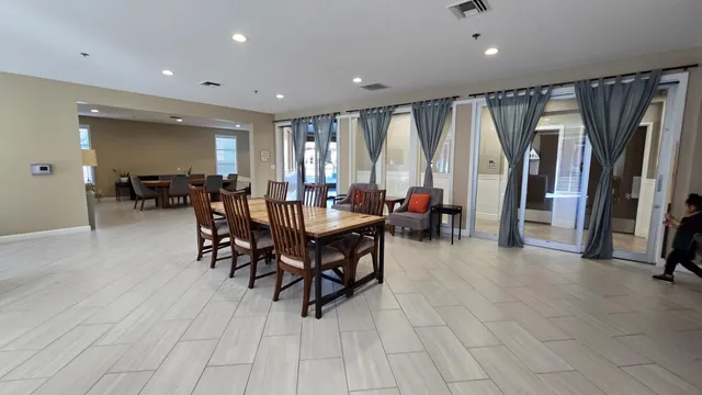 a view of a dining room with furniture window and outside view