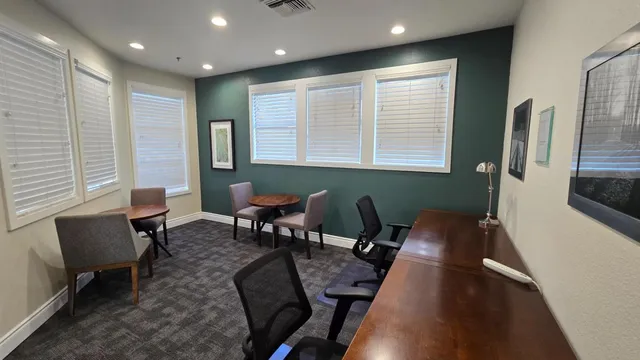 a workspace with furniture and a window