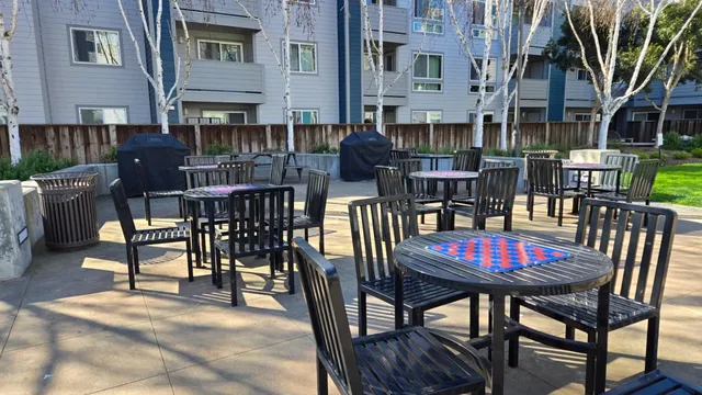 a view of a dinning table and chairs in the patio