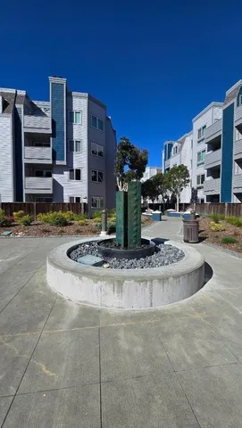 a view of a building with sitting area