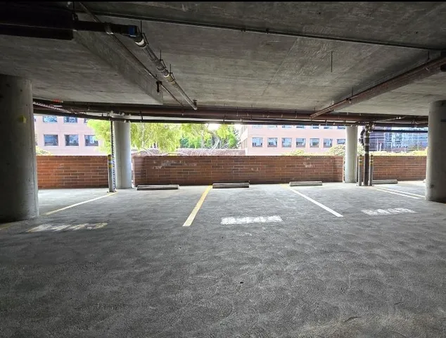 a view of empty room with a fireplace