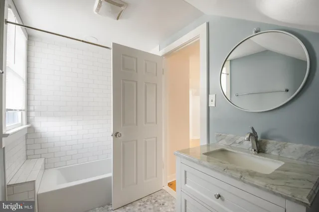 a bathroom with a sink toilet and vanity