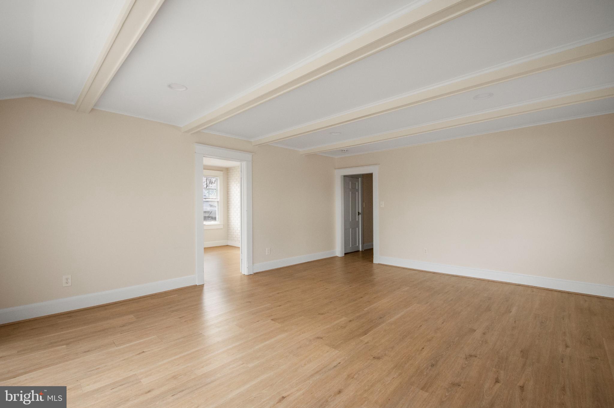 455 Deale Road Deale, MD 20751 - Photo 9 of 20 a view of an empty room with wooden floor and window