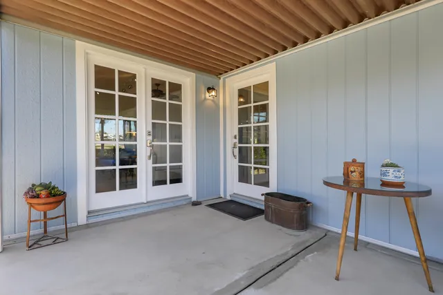 a front view of a house with a large window