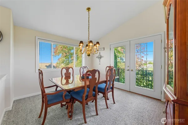 a view of a dining room with furniture window and outside view