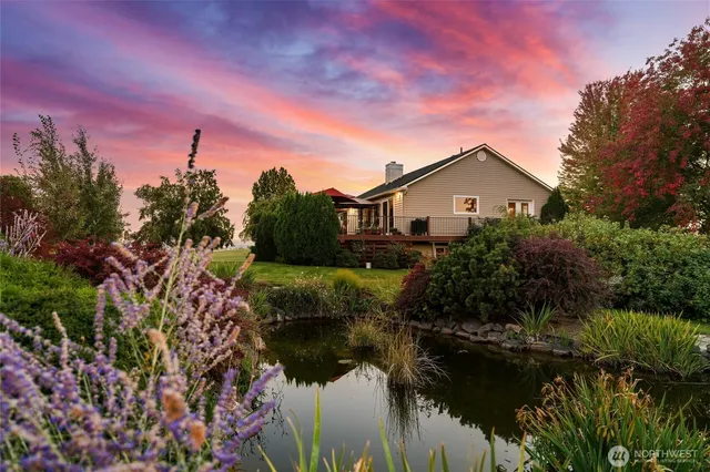 a view of a lake with a house in the background