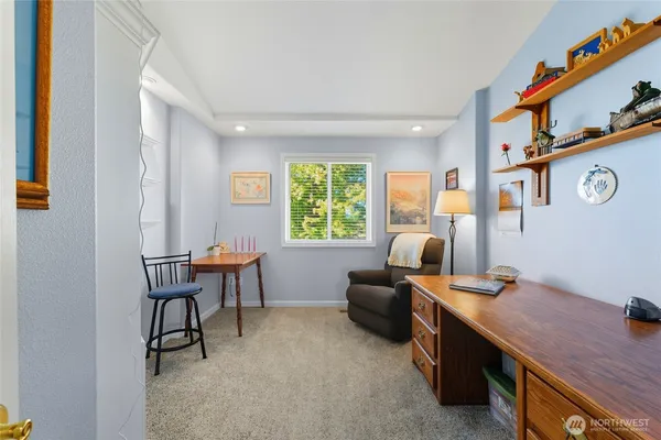 a work room with furniture and windows