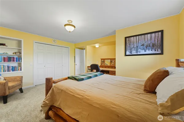 a bedroom with a bed and furniture