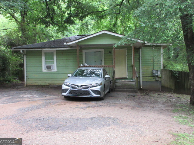a car parked in front of a house