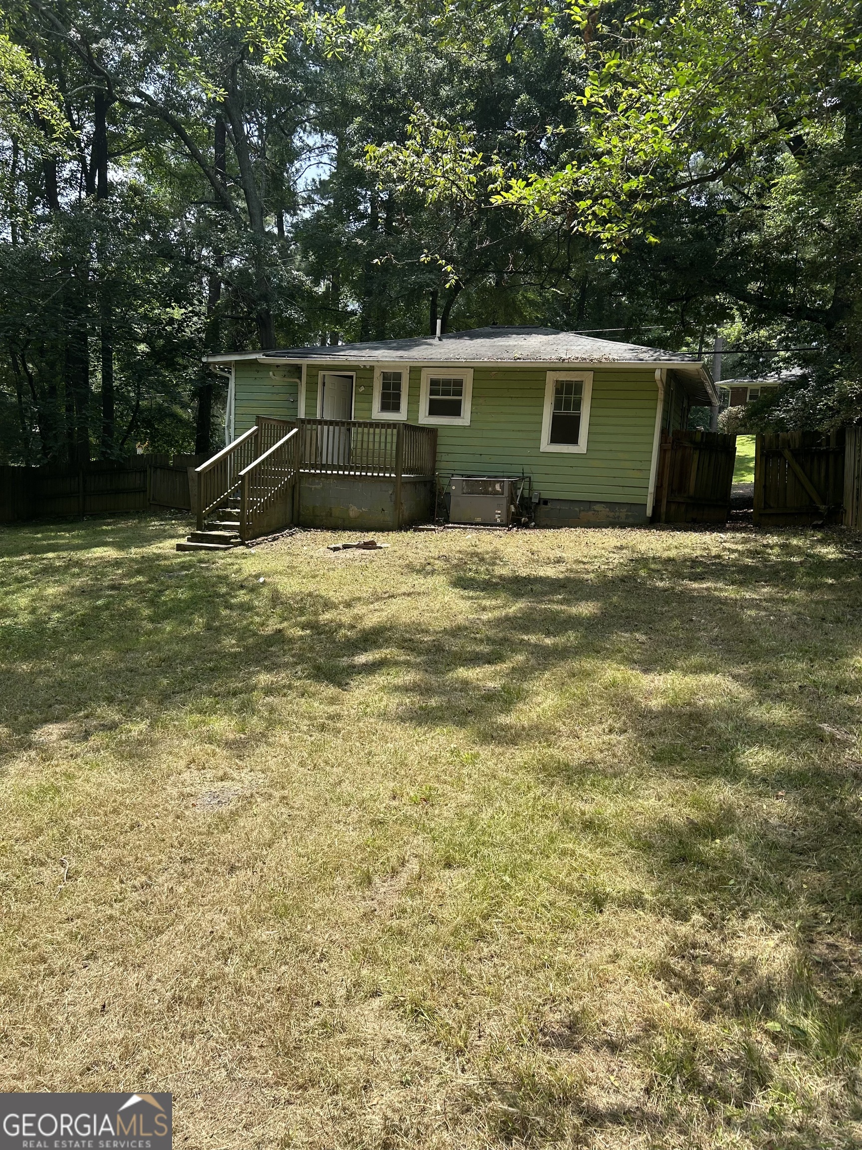 118 Tye Street Stockbridge, GA 30281 - Photo 11 of 12 a view of a house with a backyard