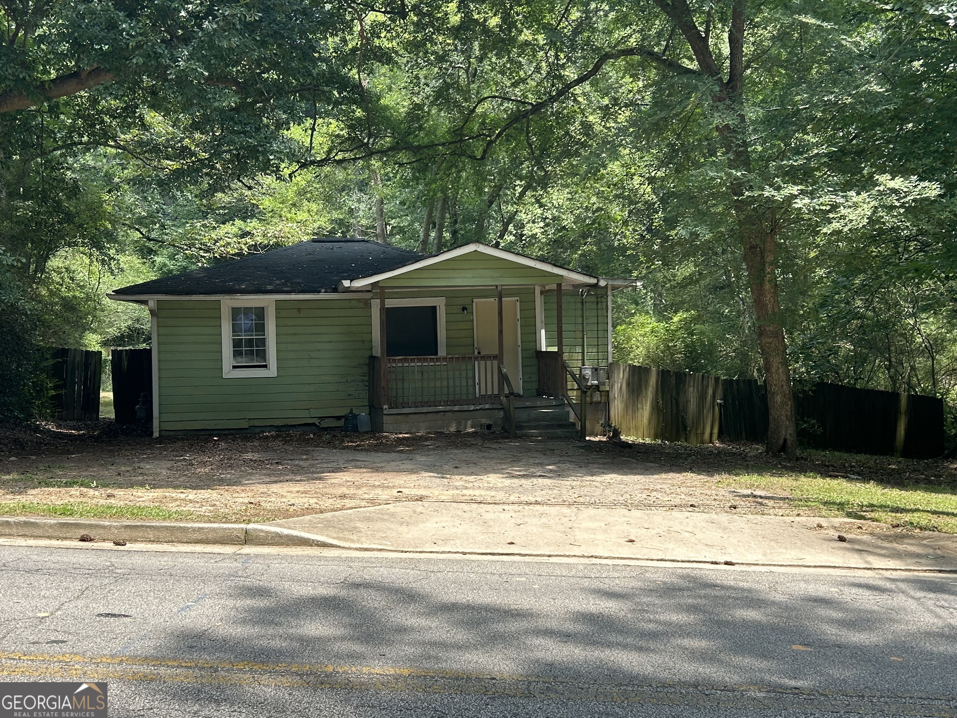 118 Tye Street Stockbridge, GA 30281 - Photo 12 of 12 a house with trees in the background