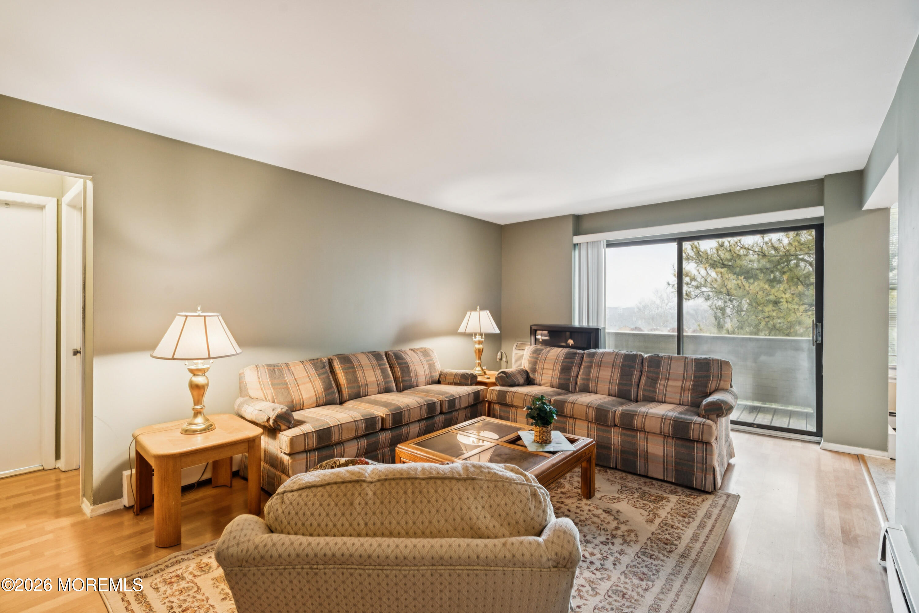 11 River Road, Unit 11L Nutley, NJ 07110 - Photo 1 of 26 a living room with furniture and a large window