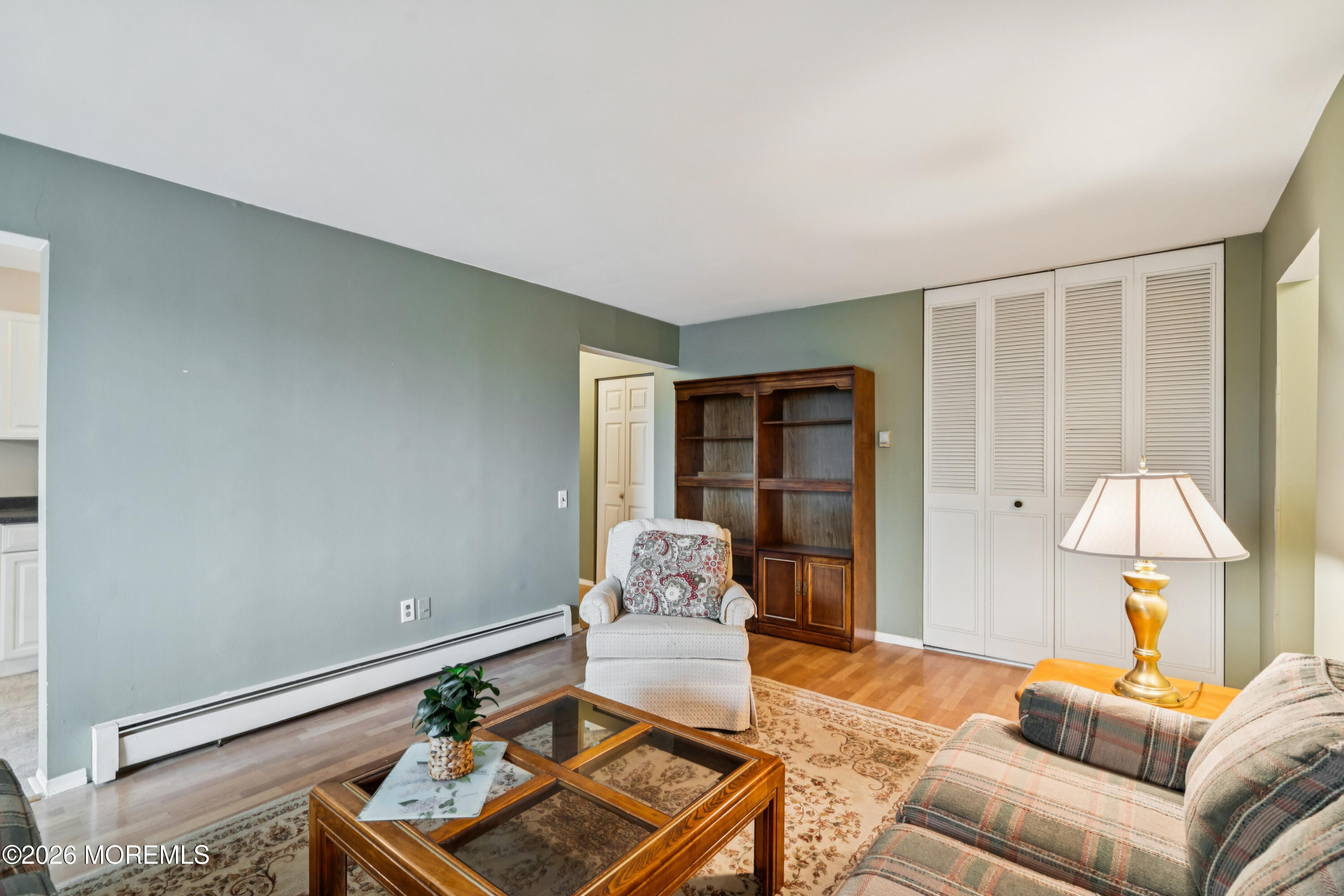 11 River Road, Unit 11L Nutley, NJ 07110 - Photo 11 of 26 a living room with furniture and a window