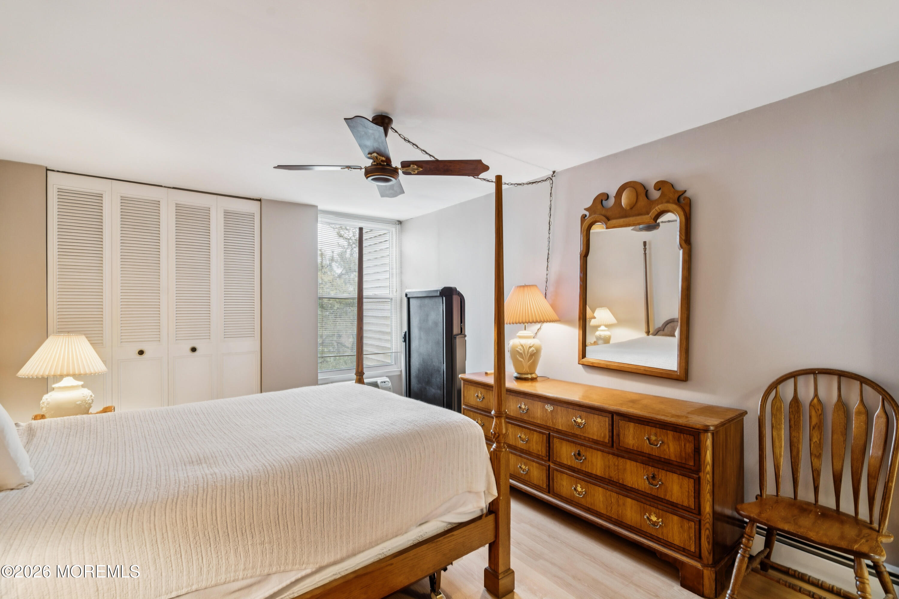 11 River Road, Unit 11L Nutley, NJ 07110 - Photo 14 of 26 a bedroom with a bed next to a window