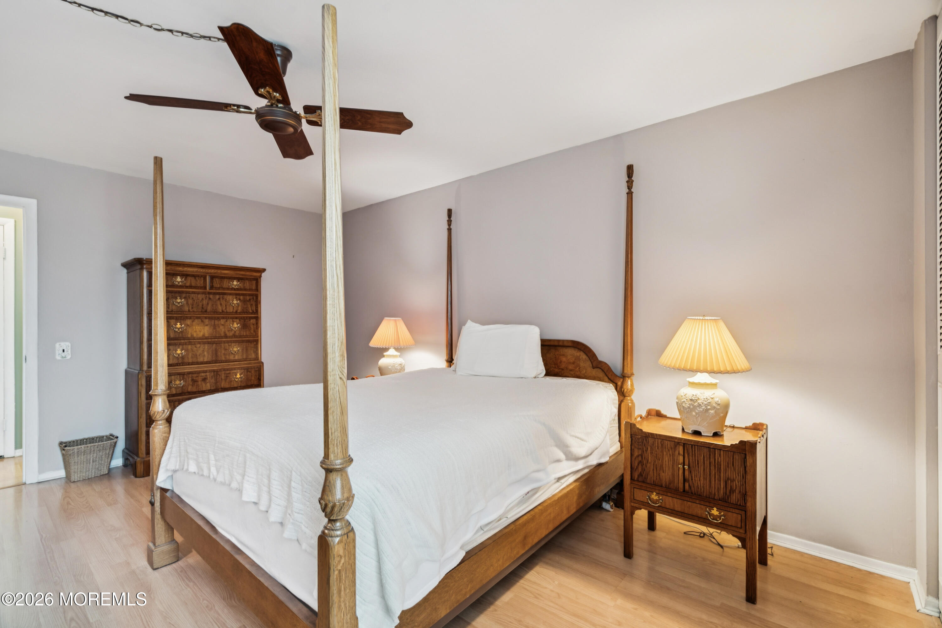 11 River Road, Unit 11L Nutley, NJ 07110 - Photo 16 of 26 a bedroom with a bed window and a table