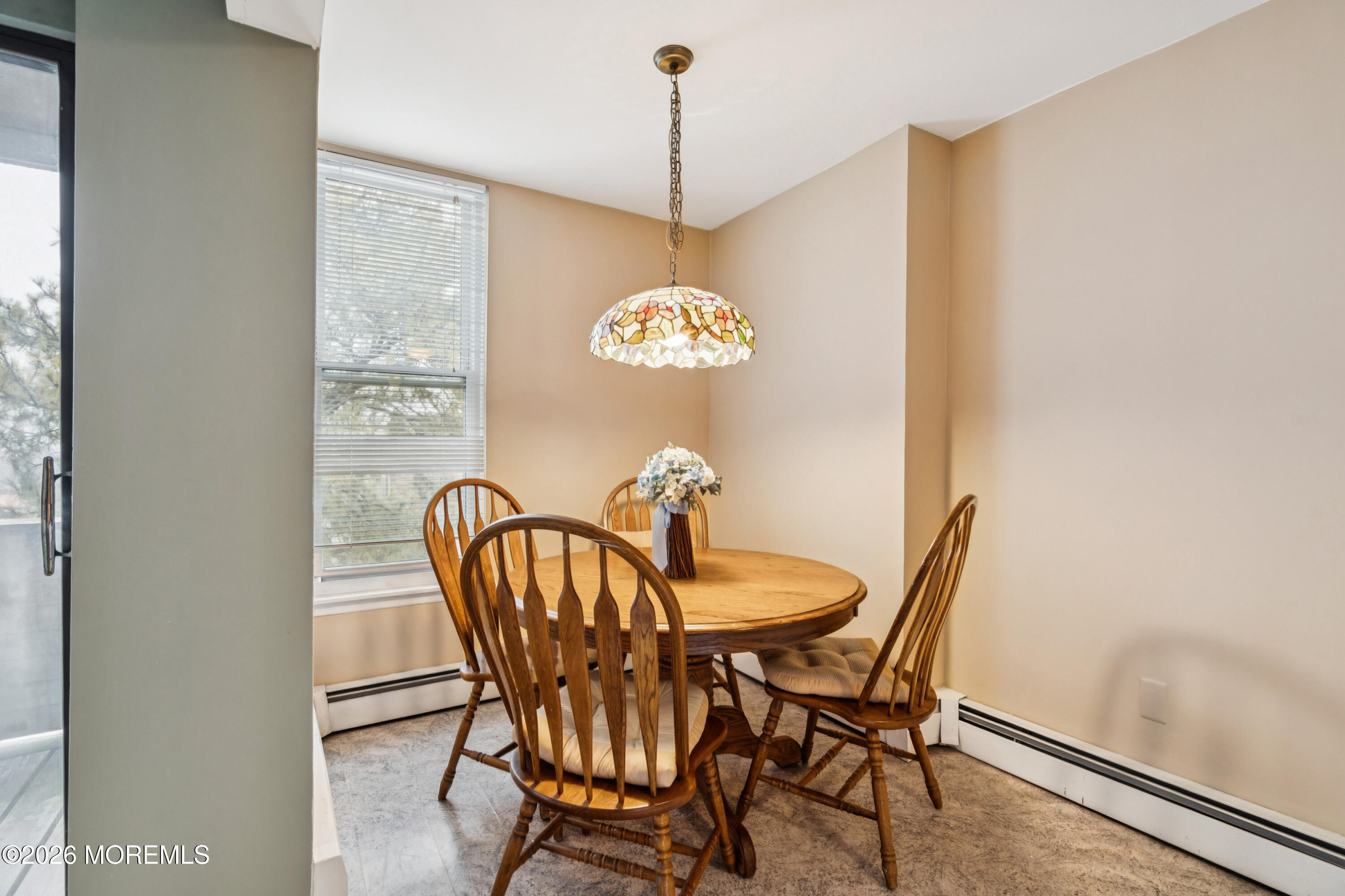 11 River Road, Unit 11L Nutley, NJ 07110 - Photo 10 of 26 a dining room with furniture and window