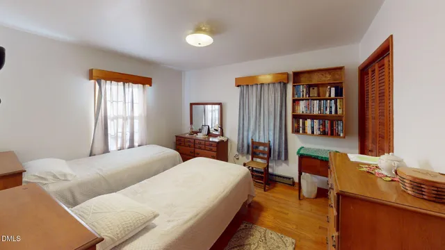 a bedroom with furniture and a window