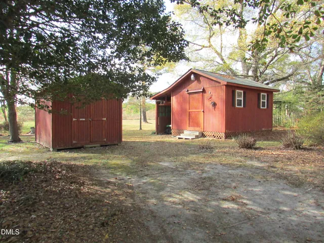 a house that has a tree in front of it