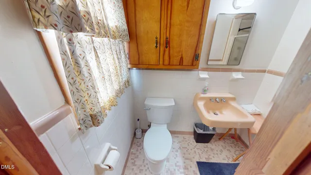 a bathroom with a toilet and a sink