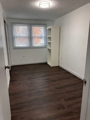 a view of entryway with stairs and wooden floor