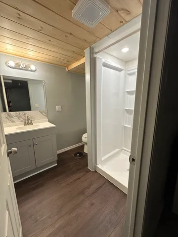 a utility room with cabinets washer and dryer