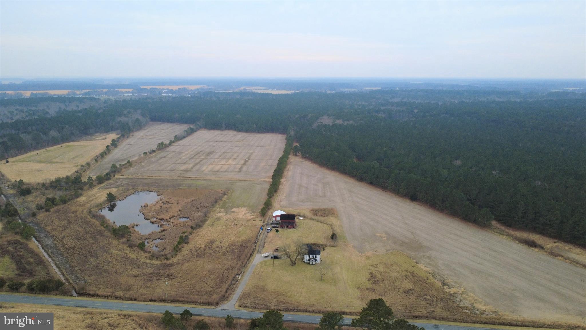 1829 Brannock Neck Road Cambridge, MD 21613 - Photo 25 of 55 an aerial view of a house with a yard