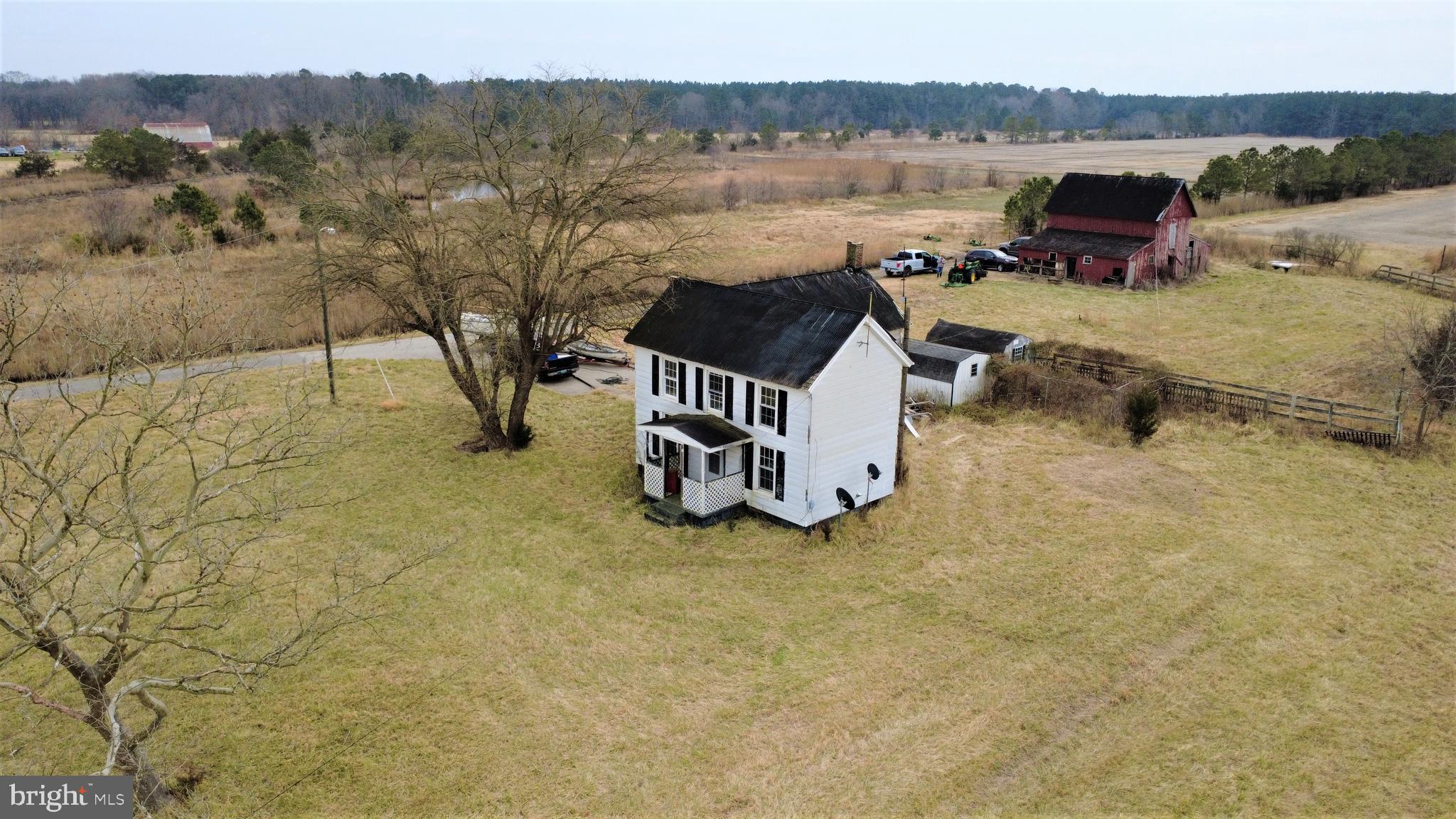1829 Brannock Neck Road Cambridge, MD 21613 - Photo 53 of 55 a view of a lake with a mountain in the background