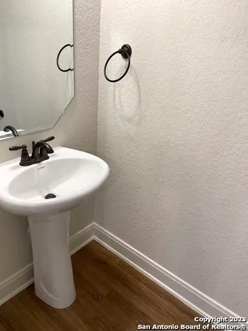 a bathroom with a sink and mirror