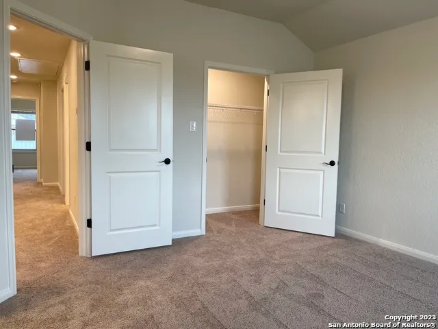 an empty room with closet area