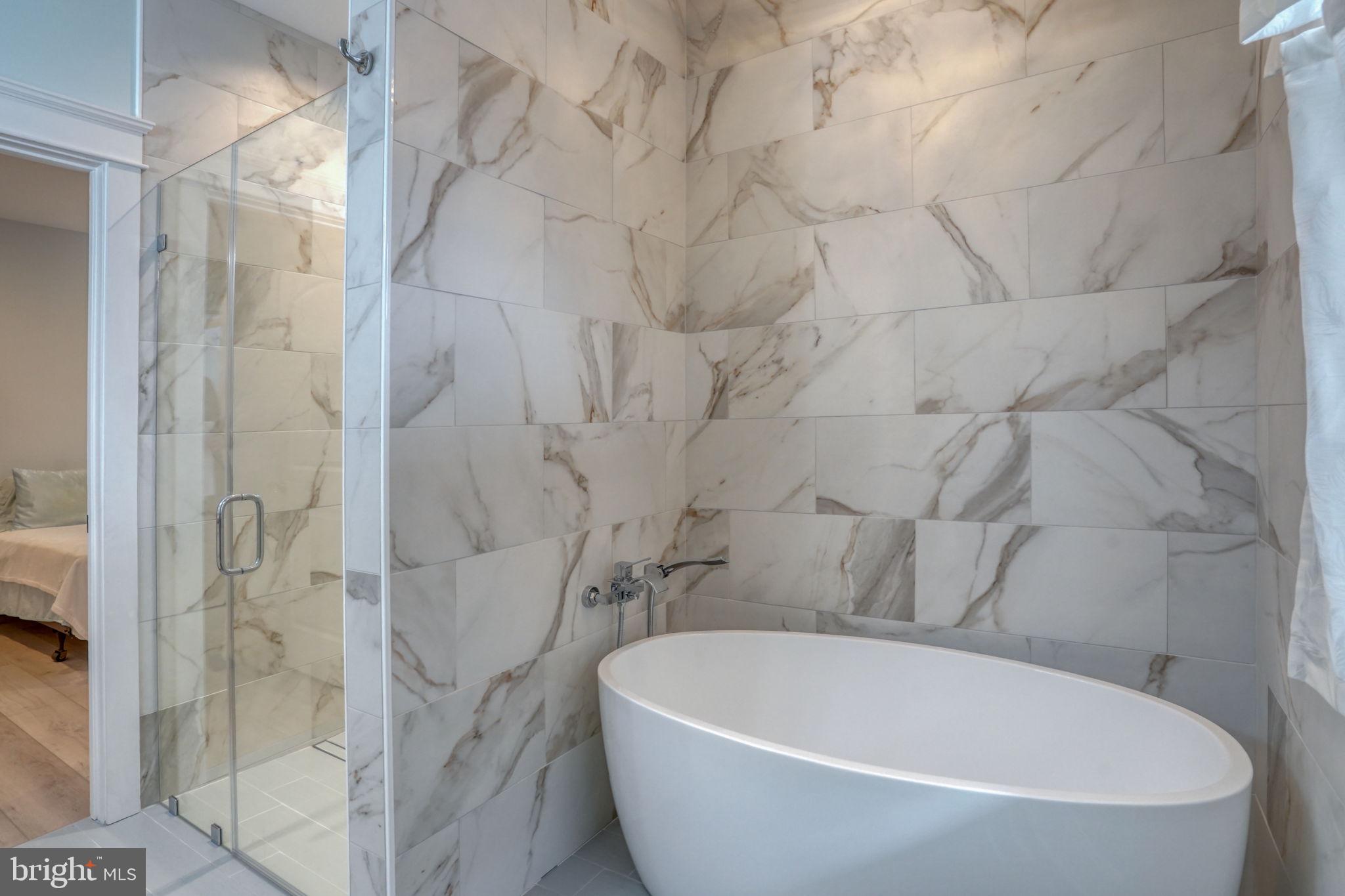 237 2nd Street Lewes, DE 19958 - Photo 15 of 52 a white bath tub sitting next to a white sink