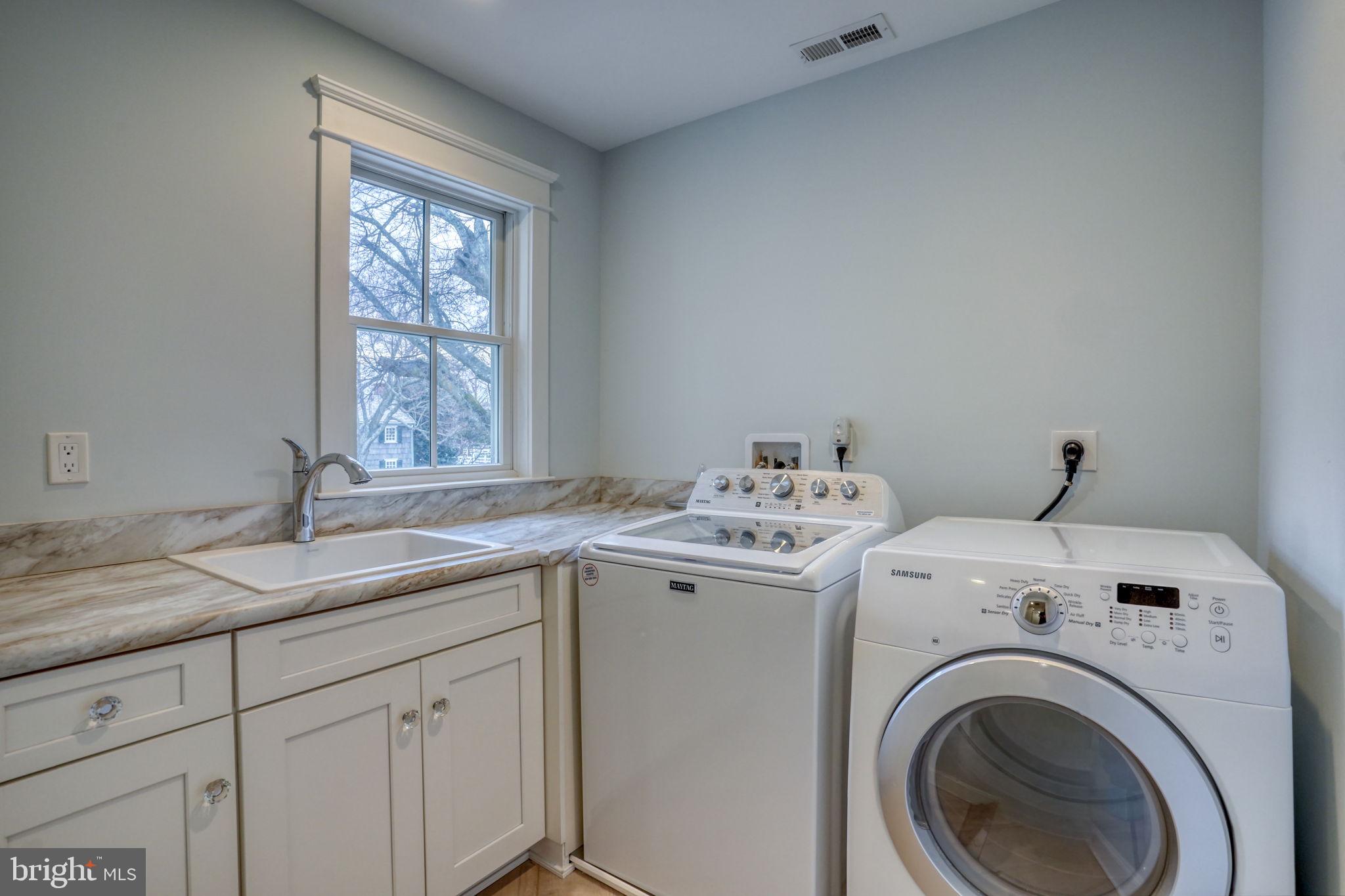 237 2nd Street Lewes, DE 19958 - Photo 16 of 52 a utility room with dryer and washer