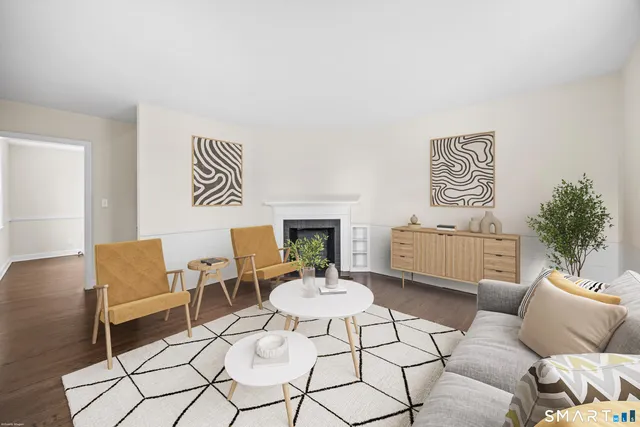 a living room with furniture and a table