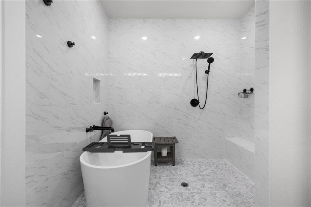 1039 Monaco Court Springtown, TX 76082 - Photo 15 of 33 Spa-inspired wet room featuring a freestanding soaking tub and a walk-in shower with a handheld shower spray and rain showerhead.