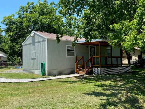 a view of a backyard with a trampoline